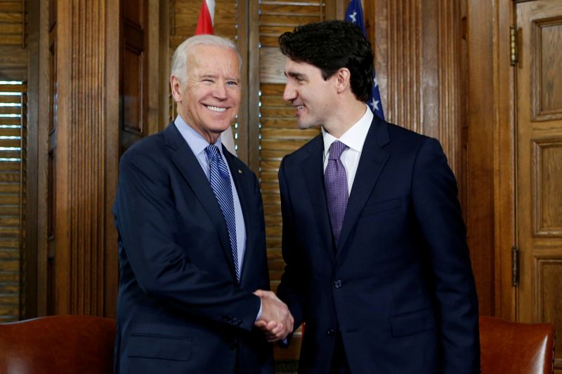 FILE PHOTO: Canada’s PM Trudeau shakes hands with U.S. Vice