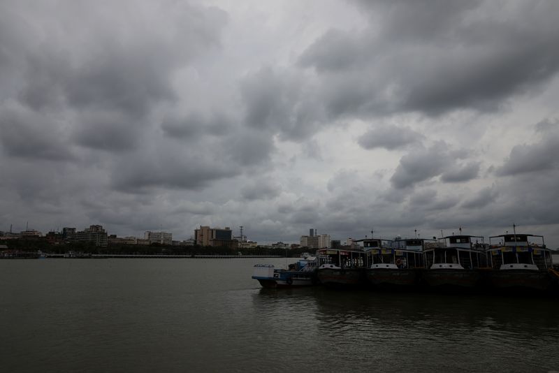 Clouds cover the skies over the river Ganges ahead of