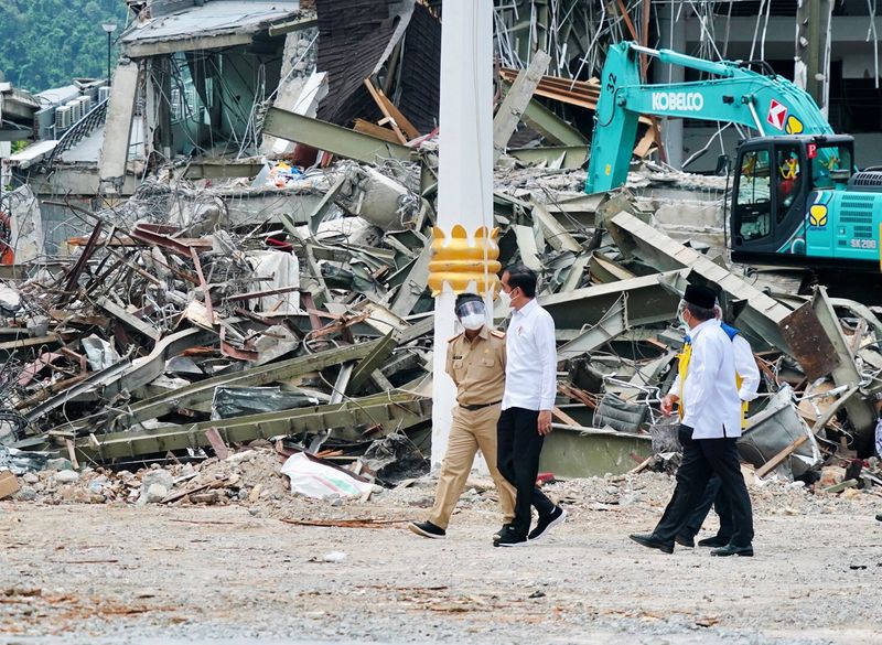 Indonesian President Joko Widodo walks during a visit inspecting the