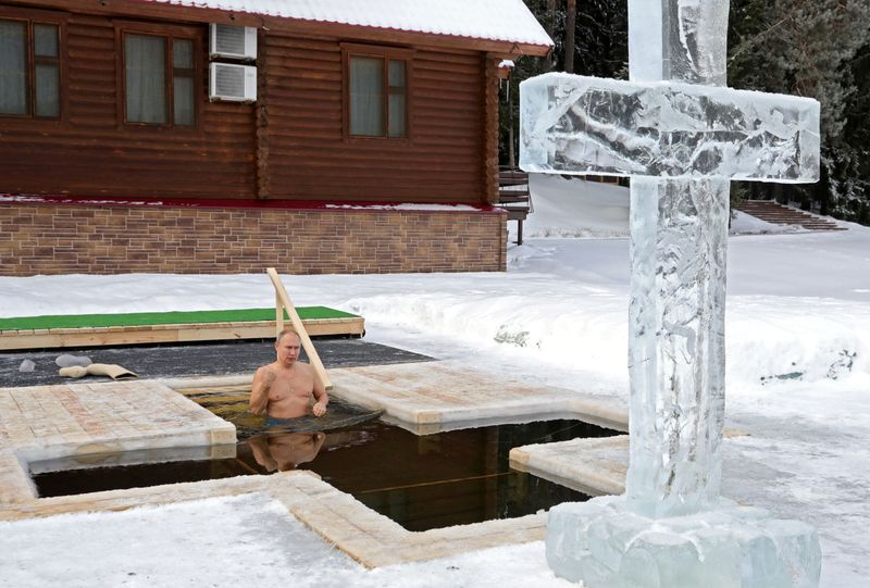 Russian President Putin takes a dip in icy waters during