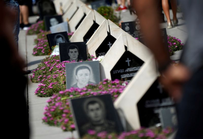 FILE PHOTO: Graves are seen at a ceremony in Tbilisi