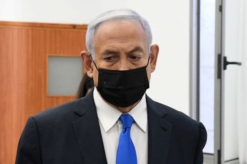 Israeli Prime Minister Benjamin Netanyahu looks on as he arrives