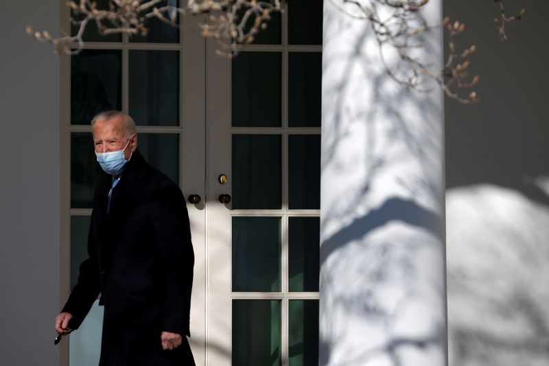 FILE PHOTO: U.S. President Biden walks into Oval Office in