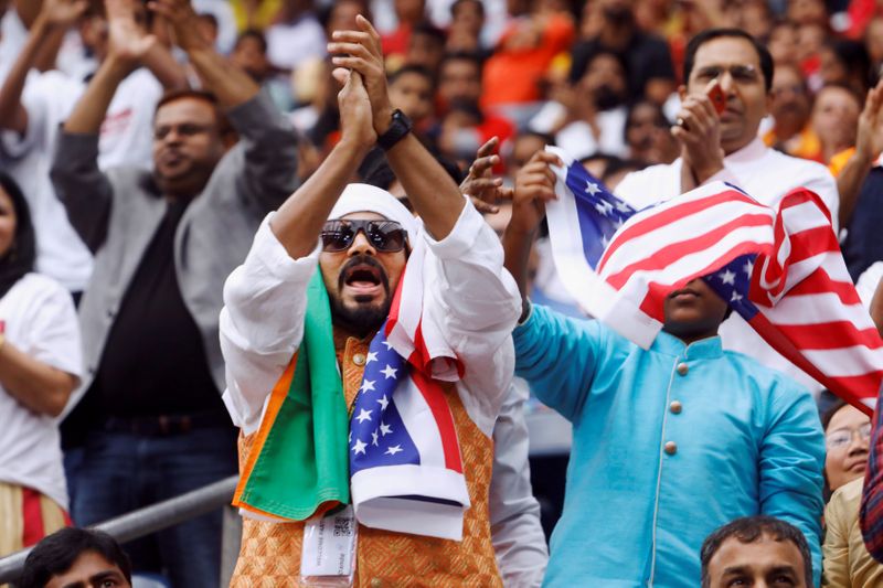 FILE PHOTO: Supporters react during a “Howdy, Modi” rally celebrating