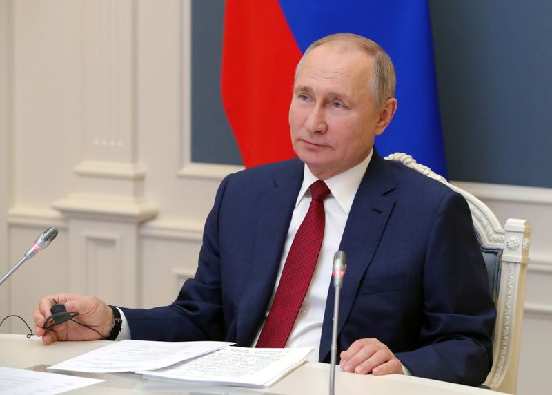 FILE PHOTO: Russia’s President Putin attends a video conference during