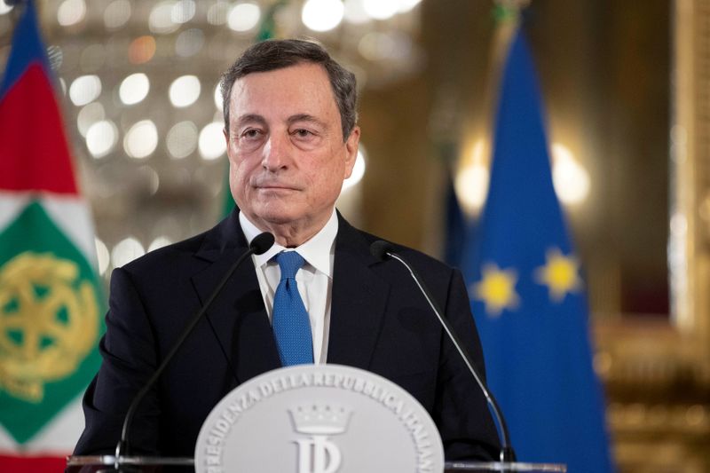 FILE PHOTO: Former European Central Bank President Mario Draghi pauses