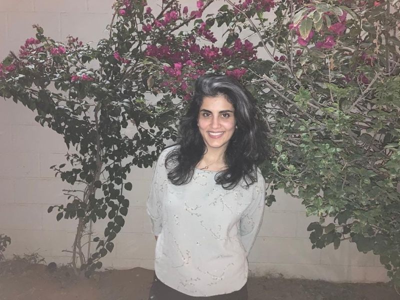 Women’s rights activist Loujain al-Hathloul poses at home