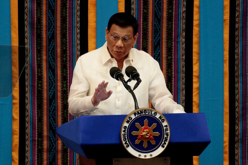 FILE PHOTO: Philippine President Rodrigo Duterte gestures during a speech