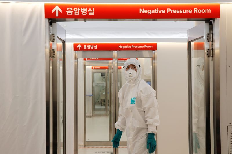 FILE PHOTO: A medical worker checks the doors inside the