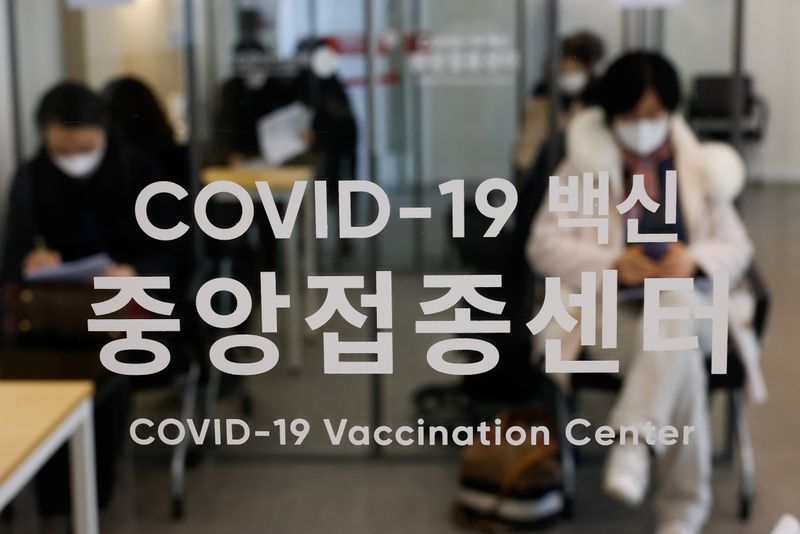 Participants take part in the coronavirus disease (COVID-19) vaccination mock
