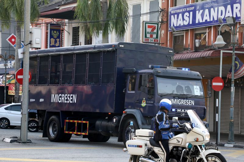 FILE PHOTO: An immigration truck carrying Myanmar migrants to be