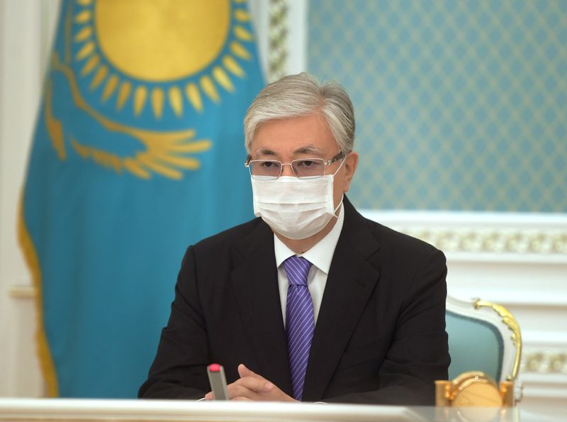 Kazakh President Kassym-Jomart Tokayev participates online in the unveiling ceremony