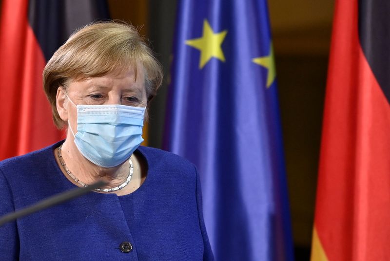 German Chancellor Angela Merkel arrives for a press conference following