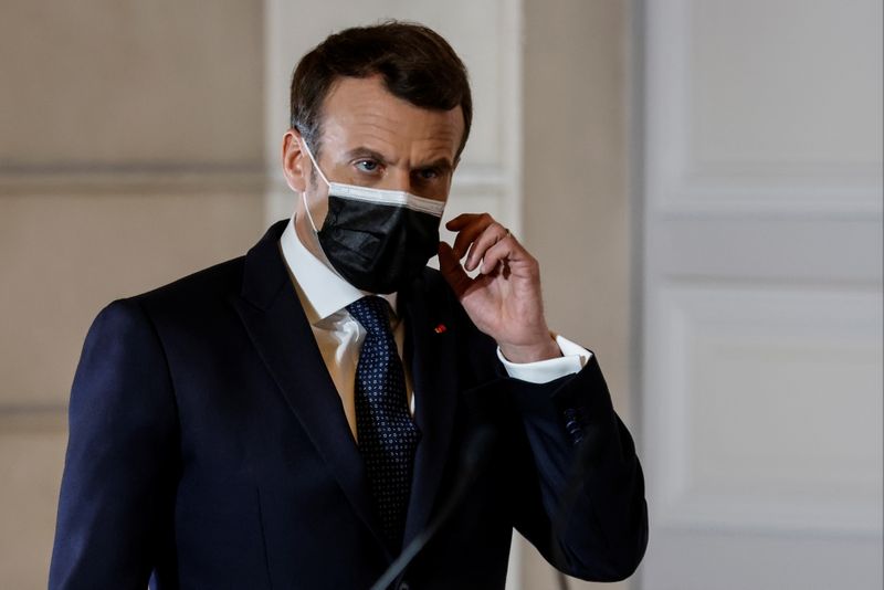 French President Emmanuel Macron arrives to deliver a press conference