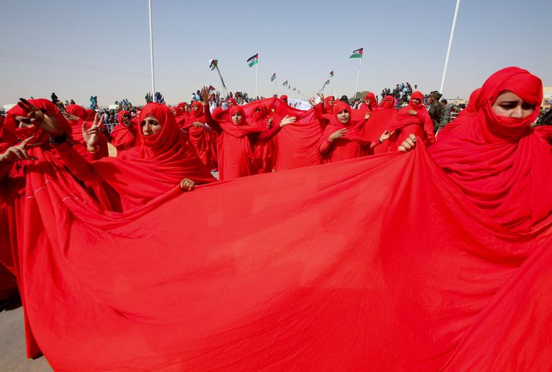 Sahrawi women take part in a parade at the Awserd