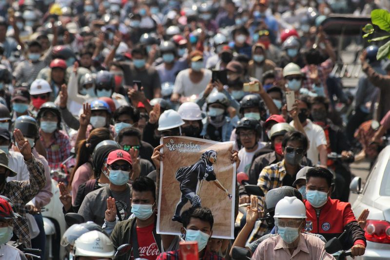 People attend the funeral of Angel a 19-year-old protester also