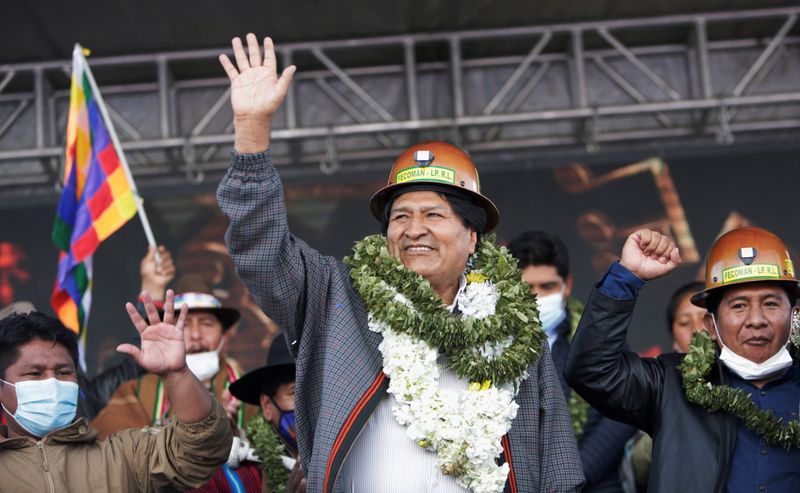 FILE PHOTO: Former Bolivian President Evo Morales meets people from