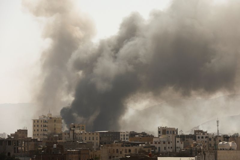 Smoke billows from the site of Saudi-led air strikes in