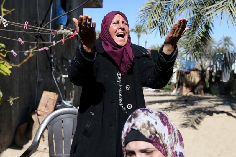 Relatives of three Palestinian fishermen from Allaham family mourn during