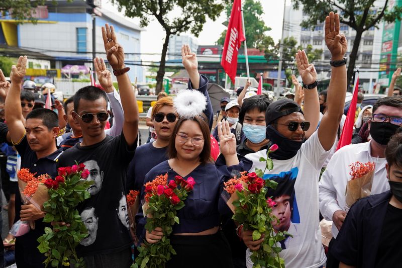 Anti-government protesters leaders Panusaya “Rung” Sithijirawattanakul, Panupong “Mike” Jadnok, and