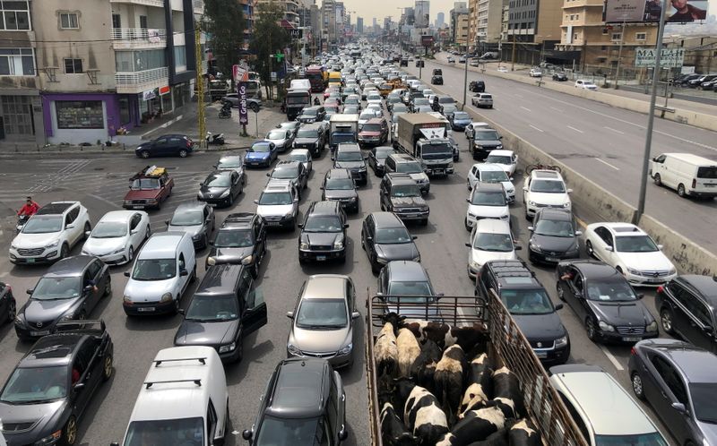 Vehicles are stuck in a traffic jam caused by demonstrators