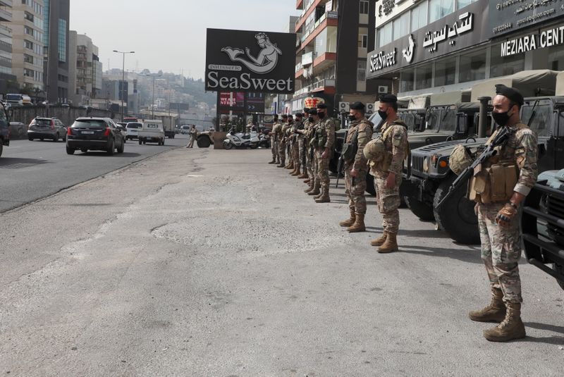 Lebanese army soldiers stand together as they are deployed in