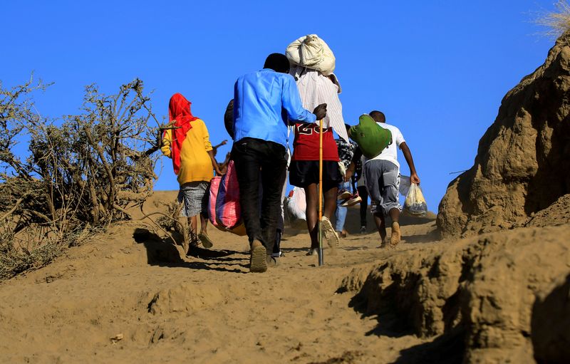 FILE PHOTO: Ethiopians cross into Sudan as they flee the