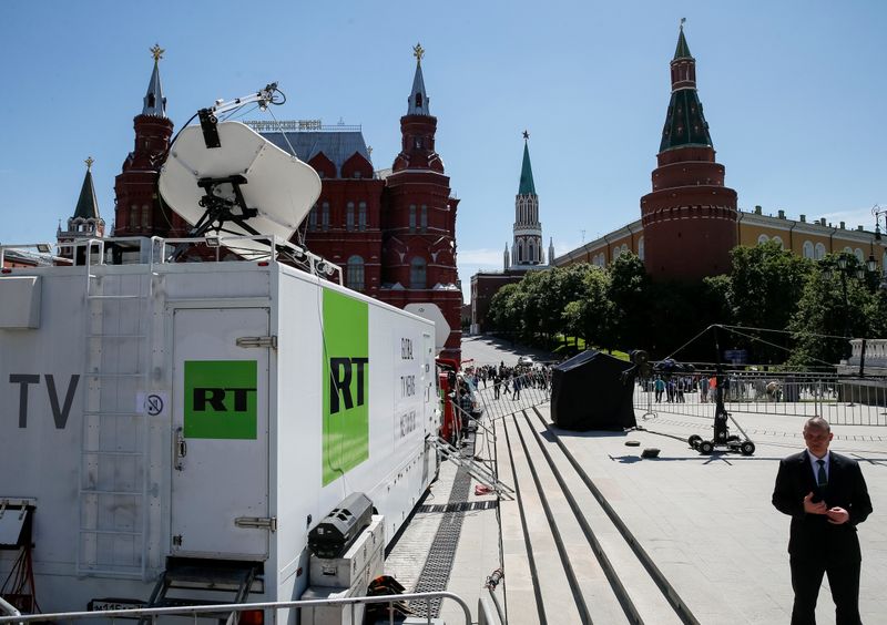 FILE PHOTO: Vehicles of Russian state-controlled broadcaster Russia Today are