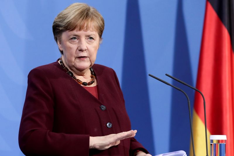 German Chancellor Angela Merkel addresses the media during a news