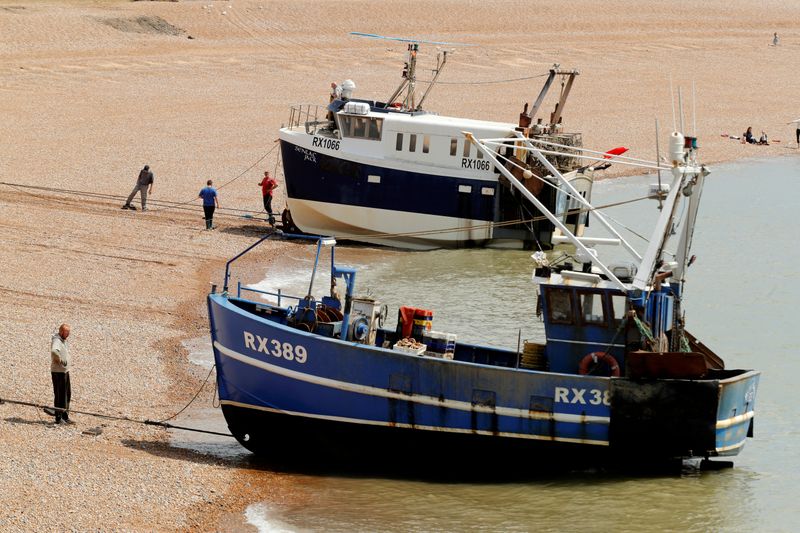 FILE PHOTO: Fishing boats and fisherman in Hastings