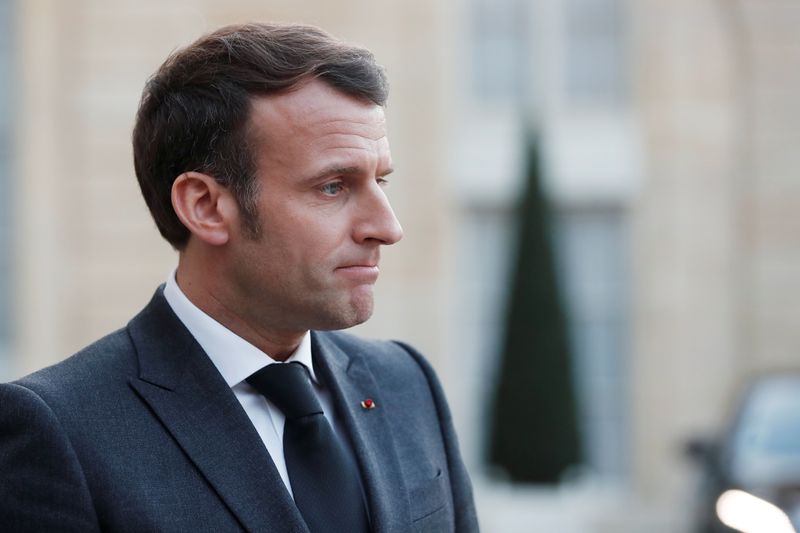 French President Emmanuel Macron, talks to the press after a