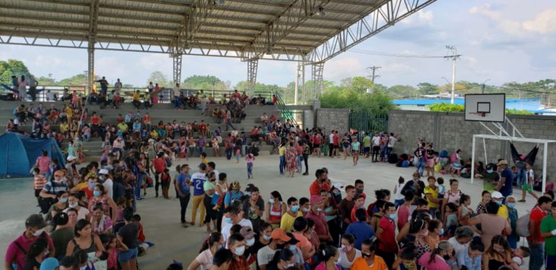 Venezuelan migrants are seen inside a coliseum where a temporary