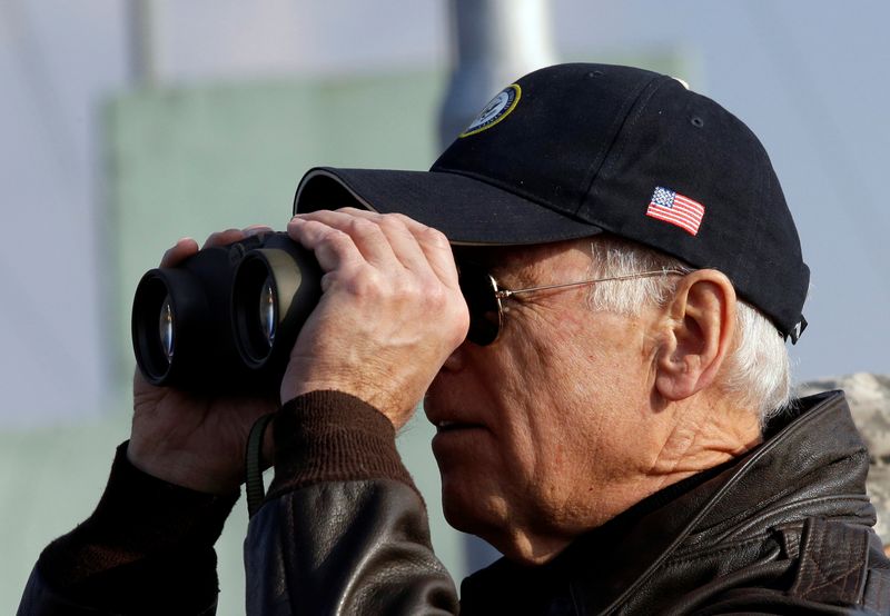 FILE PHOTO: U.S. Vice President Joe Biden looks through binoculars