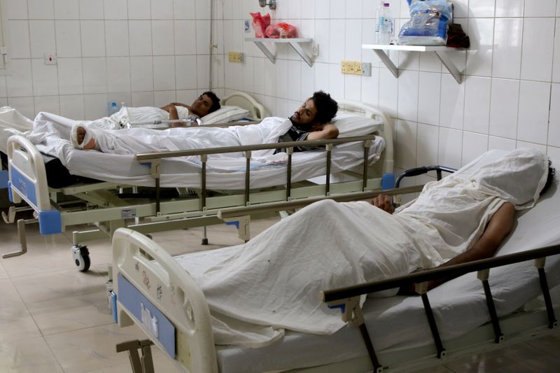 FILE PHOTO: People injured in an attack on Aden airport