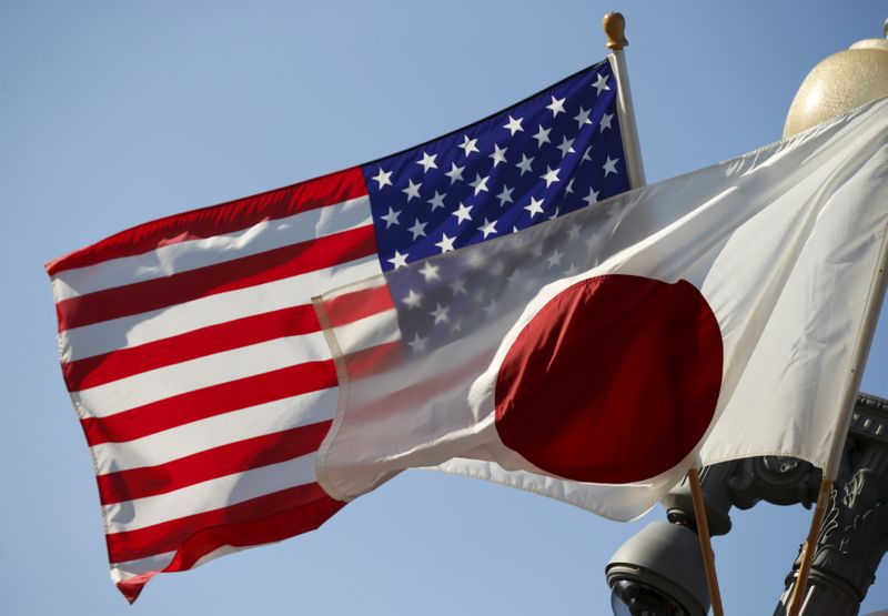 FILE PHOTO: Japan and U.S. flags fly outside the White
