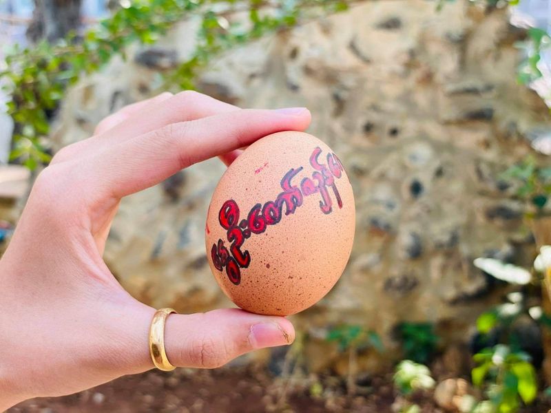 Easter eggs are painted with slogans from the protests against