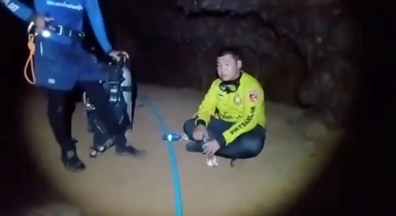 Rescue workers are seen at Phra Sai Ngam cave during