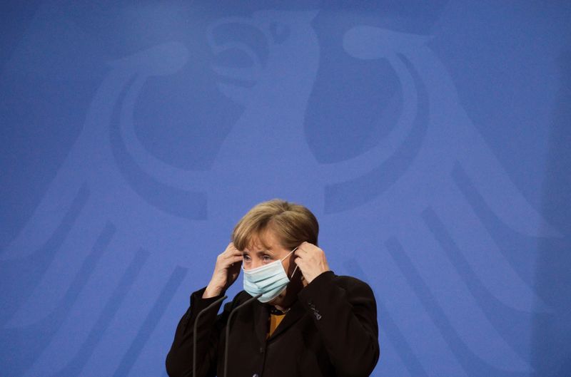 FILE PHOTO: German Chancellor Angela Merkel briefs the media after