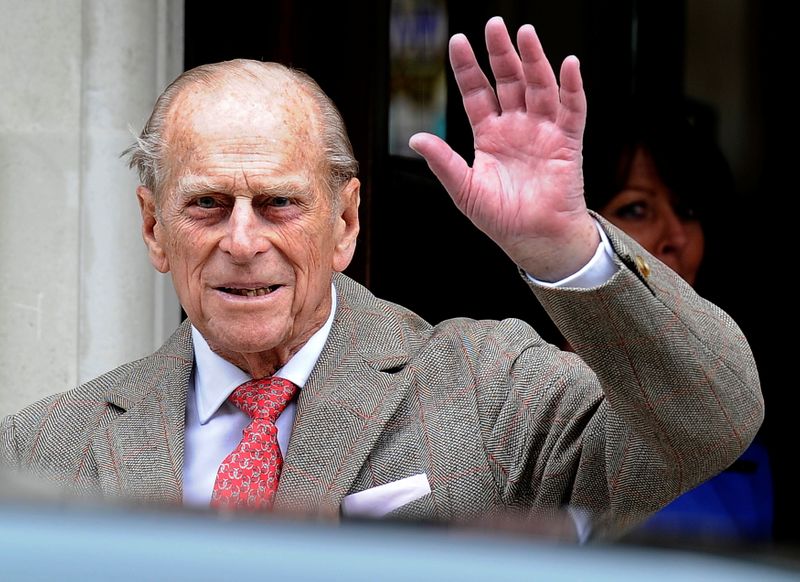 FILE PHOTO: Britain’s Prince Philip waves to members of the