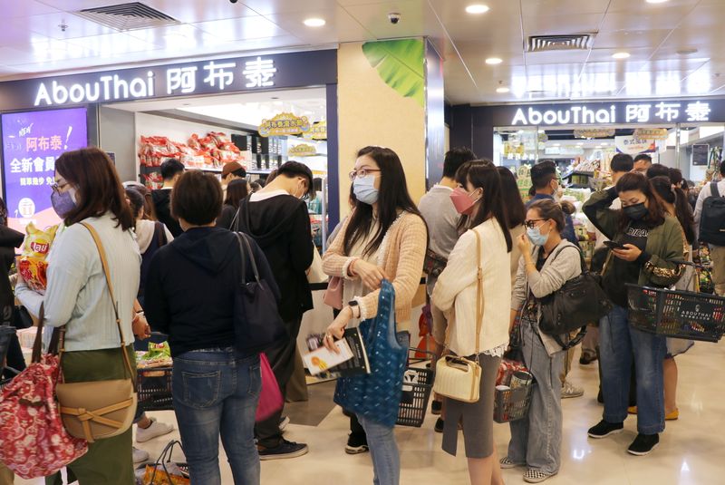 Customers queue outside “AbouThai” shop in Hong Kong