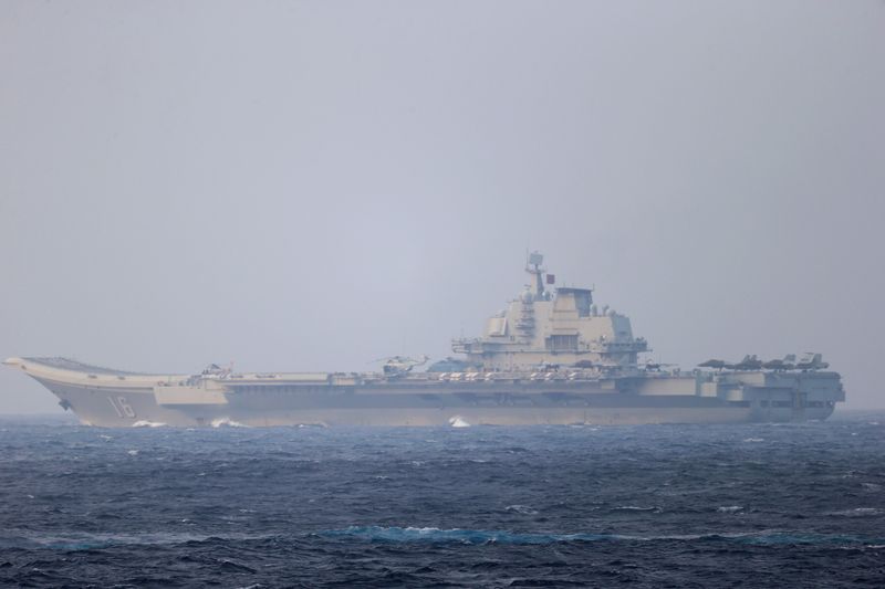 FILE PHOTO: Chinese aircraft carrier Liaoning sails through the Miyako