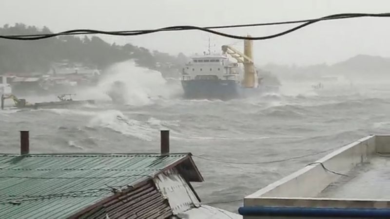 Waves crash the shore as Super Typhoon Surigae moves close