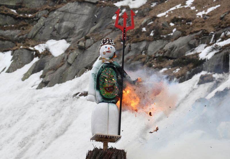 The Boeoegg, a snowman, burns in a bonfire on Devil’s