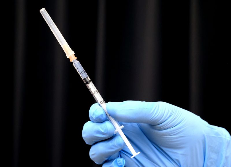 Medical workers receive doses of the vaccine against the coronavirus