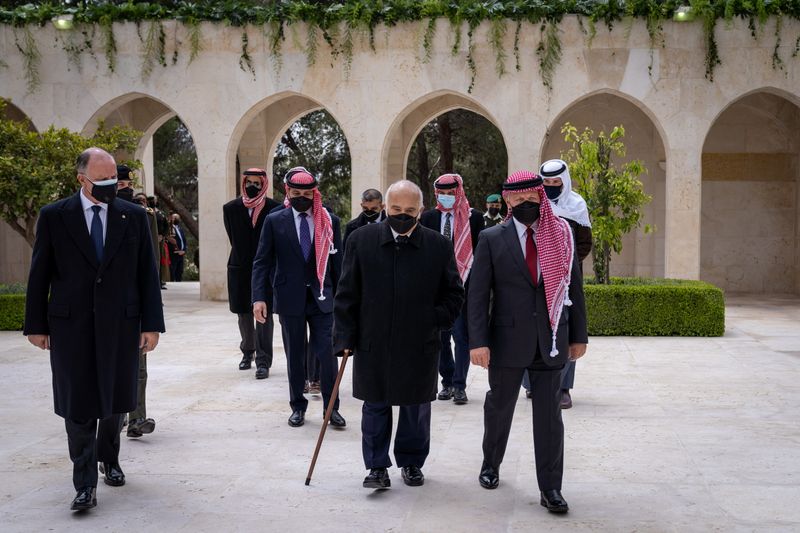FILE PHOTO: Jordan’s King Abdullah II and members of the