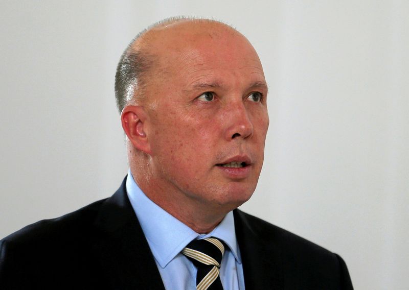 FILE PHOTO: Australian Minister of Home Affairs Peter Dutton inspects