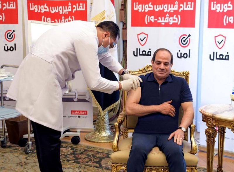 Egyptian President Abdel Fattah al-Sisi receives a dose of a