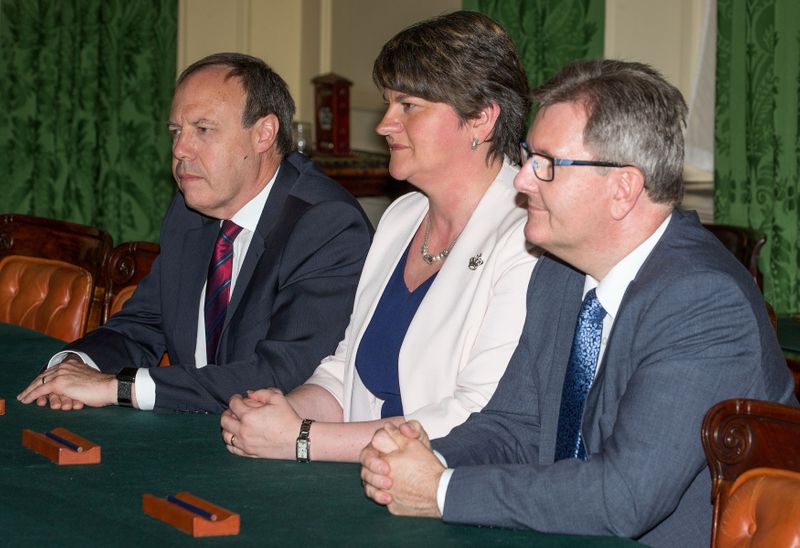 FILE PHOTO: Democratic Unionist Party leader Arlene Foster sits opposite
