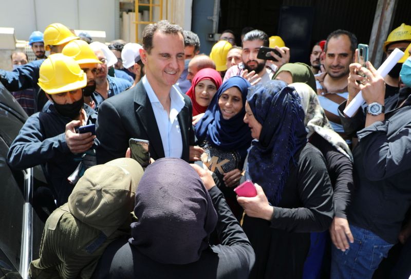 Syrian President Bashar al-Assad visits the industrial city of Hassia