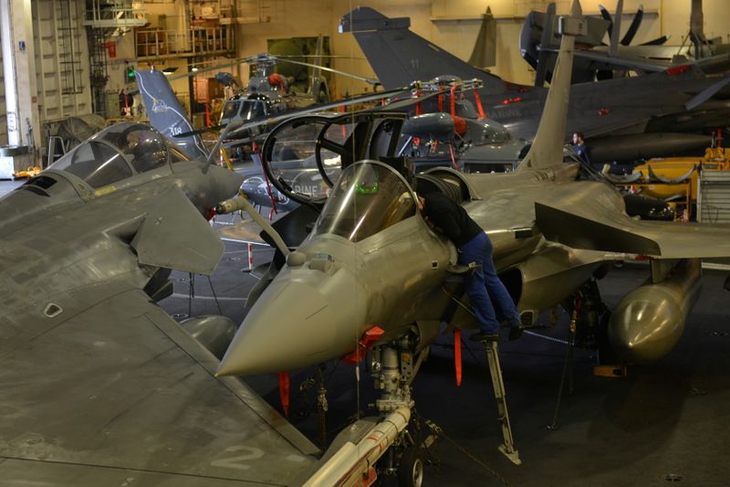 FILE PHOTO: An engineer works on a French Navy Rafale